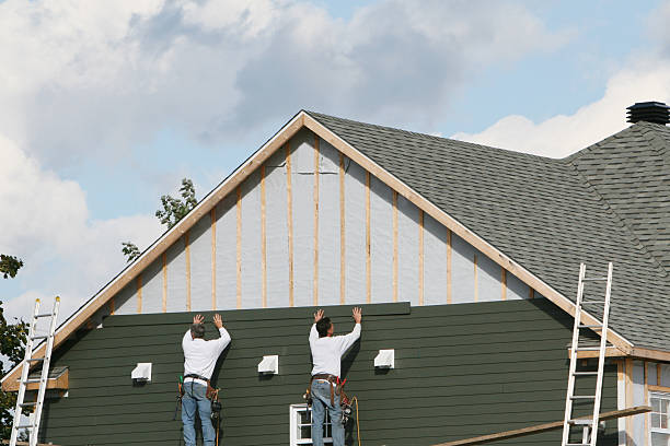 Professional Storm Damage Siding Repair technician working in Norwood Young America, MN